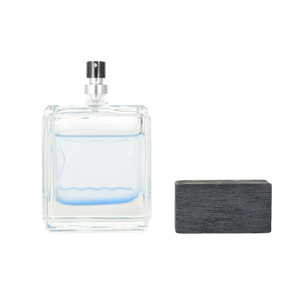 Frasco de perfume de vidrio de lujo de 100 ml con tapa de madera y rociador de niebla fina de aluminio
