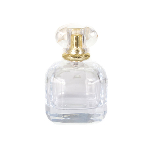 La última botella de perfume caliente con tapa de plástico transparente de fondo grueso y rociador de niebla dorada