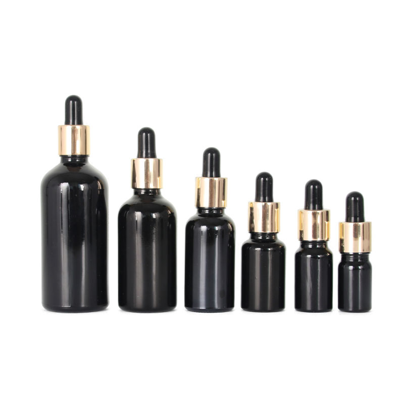 5mL 10mL 15mL 20mL 30mL 50mL 60mL 100mL Varios volúmenes Botella de vidrio de aceite esencial negro con cuentagotas de aluminio dorado para el cuidado de la piel