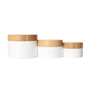 Tarro de crema de PP blanco con tapa de bambú natural