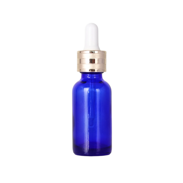 Botella de aceite esencial de vidrio azul de 30 ml para uso diario