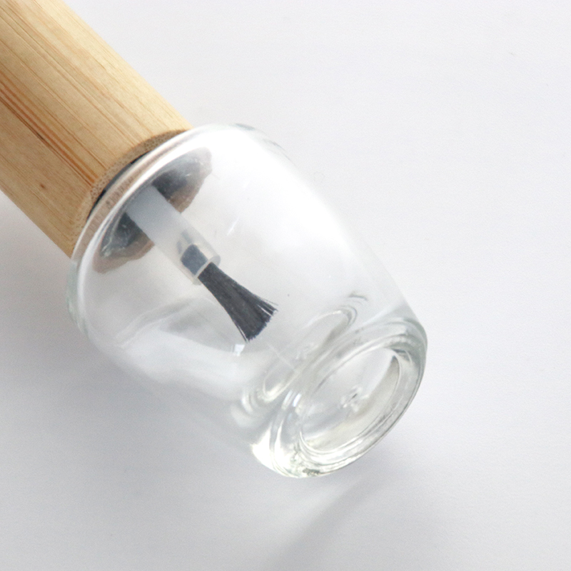 Botella de esmalte de uñas de vidrio vacía transparente con tapa de bambú
