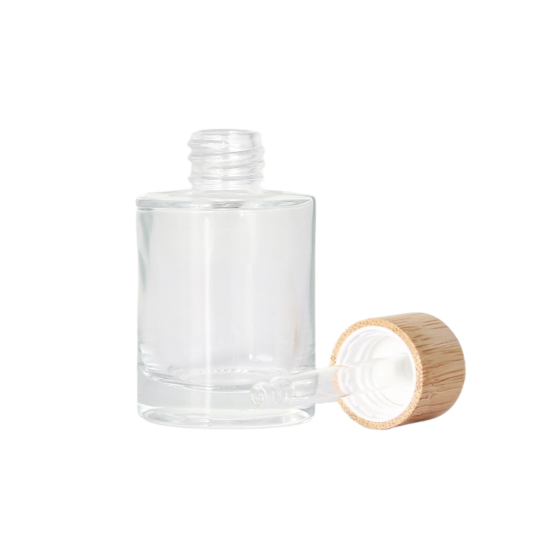 Botella de loción de bambú de vidrio transparente con dispensador de bomba de bambú